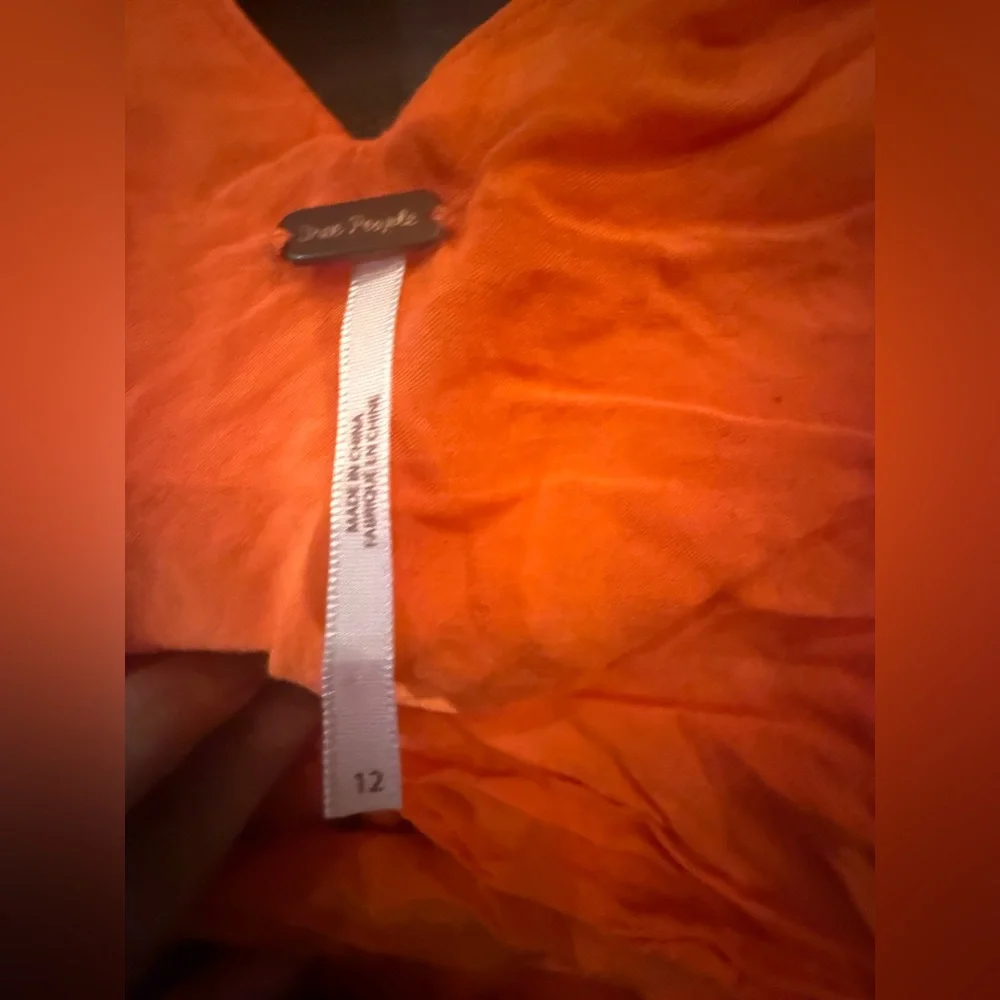 Free People. Orange Long Sleeveless Vneck Front & Back Blouse. Size 12.